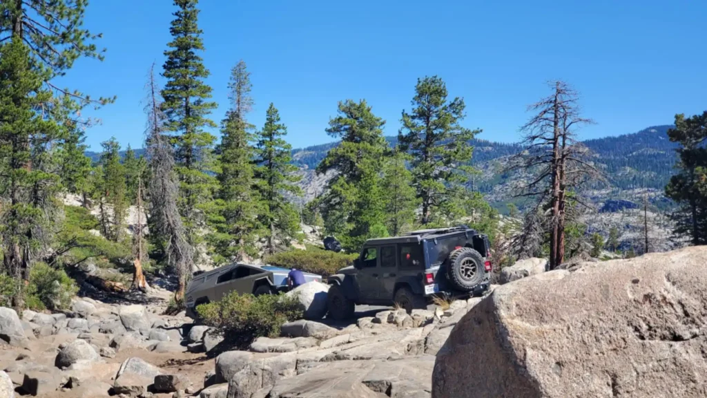 A Jeep Wrangler JL Rubicon frequently assisted the Tesla Cybertruck through difficult sections of the Rubicon Trail.