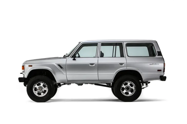 A 1.5-inch lift, flipped front shackles, and 35-inch all-terrain tires give the FJ60 modern trail capability without altering its classic look.